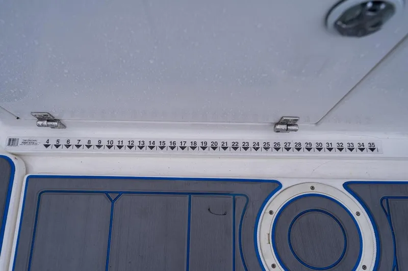 Slide: The Image of Ruler on 2002 Century 3200 Walk-Around boat deck with blue trim. - 21