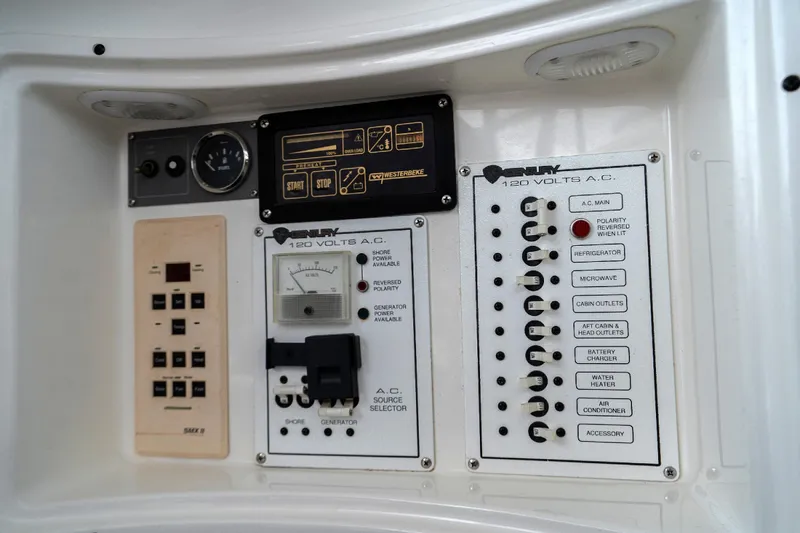 Slide: The Image of Century 3200 Walk-Around 2002 electrical control panel with switches and meters. - 24