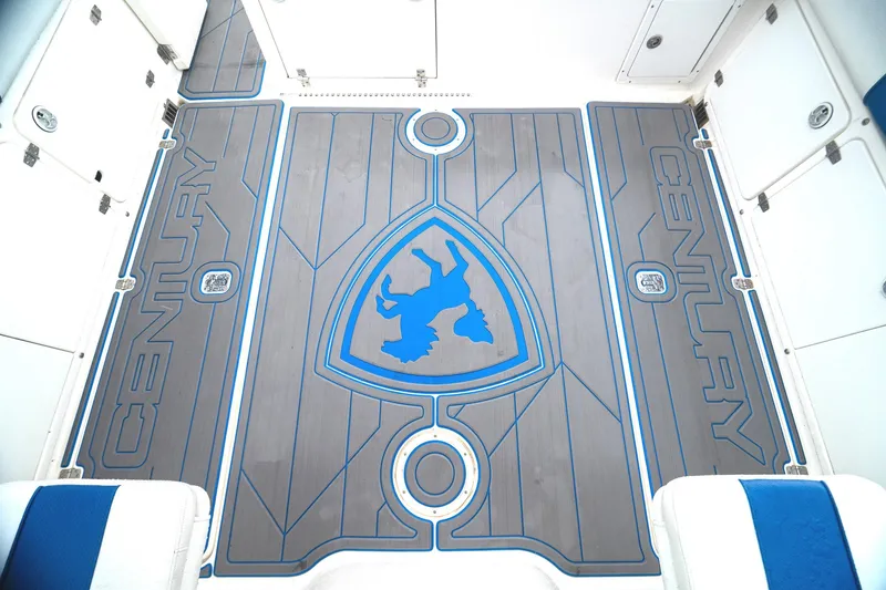 Slide: The Image of Century 3200 Walk-Around 2002 boat deck with custom blue and gray design. - 29