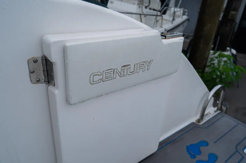 Slide: The Image of Century 3200 Walk-Around boat, 2002 model, featuring a white exterior with logo detail. - 31