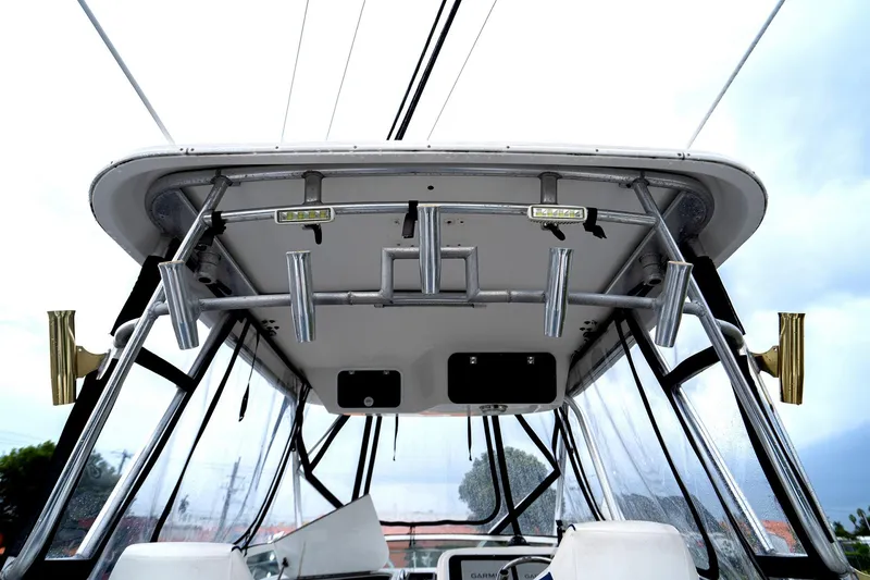 Slide: The Image of 2002 Century 3200 Walk-Around boat, view of cockpit and rod holders. - 5