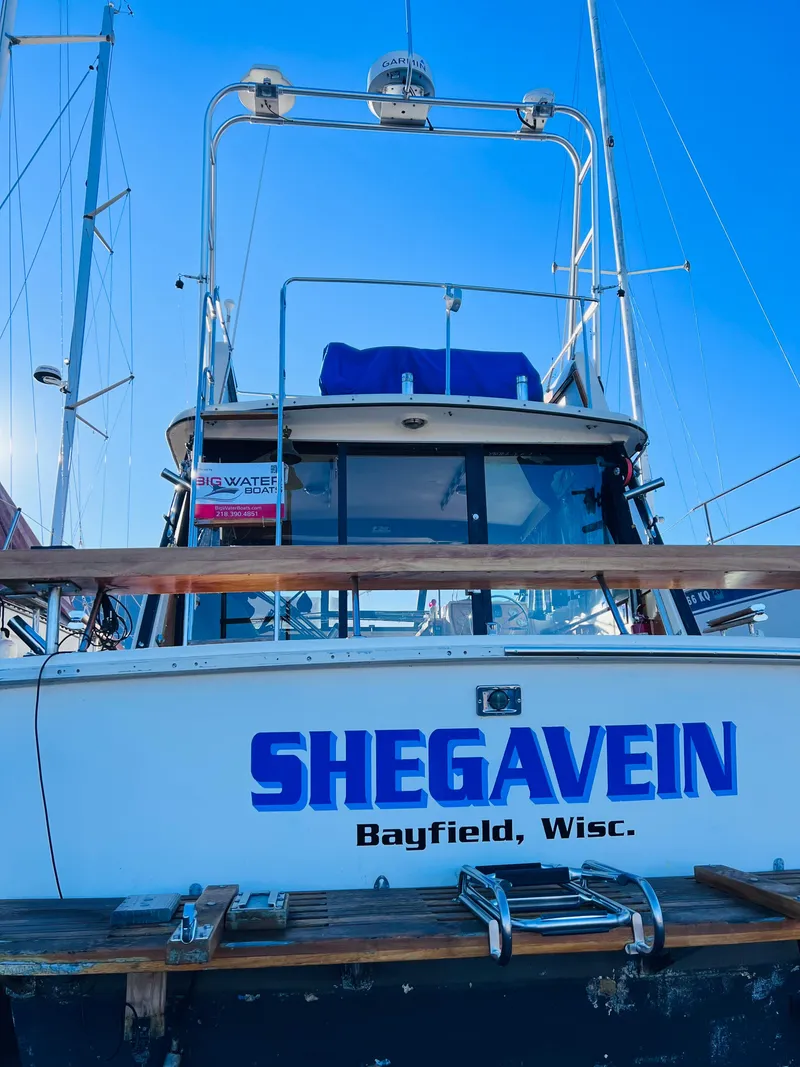 Slide: The Image of 1976 Trojan F 32 boat named "SHEGAVEIN" docked in Bayfield, Wisconsin. - 7