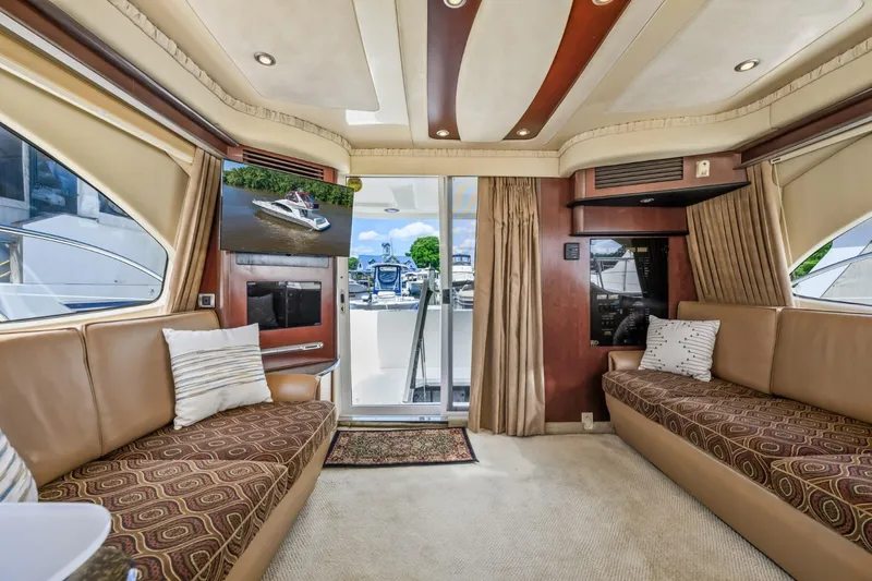 Slide: The Image of Luxurious interior of a 2005 Sea Ray 420 Sedan Bridge yacht with plush seating. - 14