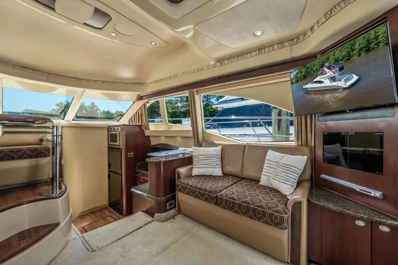 Slide: The Image of Luxurious interior of 2005 Sea Ray 420 Sedan Bridge yacht with plush seating and modern amenities. - 15