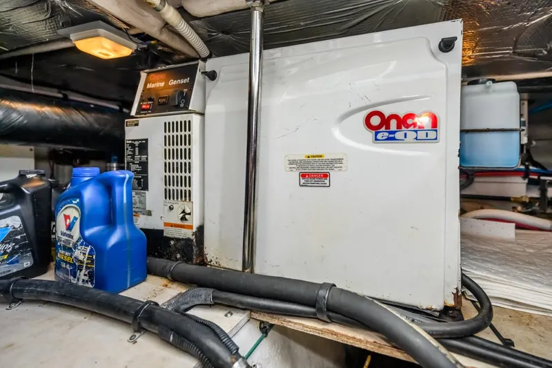 Slide: The Image of Engine room of a 2005 Sea Ray 420 Sedan Bridge with Onan generator. - 27
