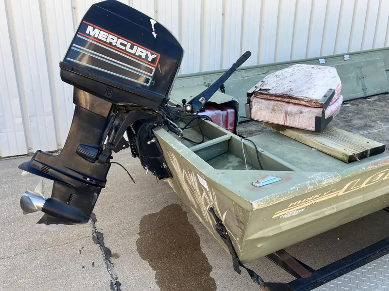 Slide: The Image of 1994 Lowe 1960 HUSKY boat with Mercury outboard motor. - 10