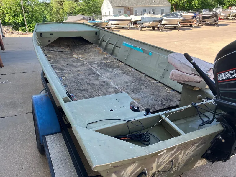 Slide: The Image of 1994 Lowe 1960 HUSKY boat on trailer, empty interior, outboard motor. - 5