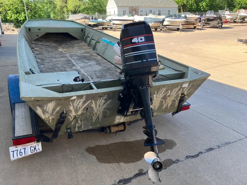 Slide: The Image of 1994 Lowe 1960 HUSKY boat with 40 HP outboard motor on trailer. - 6