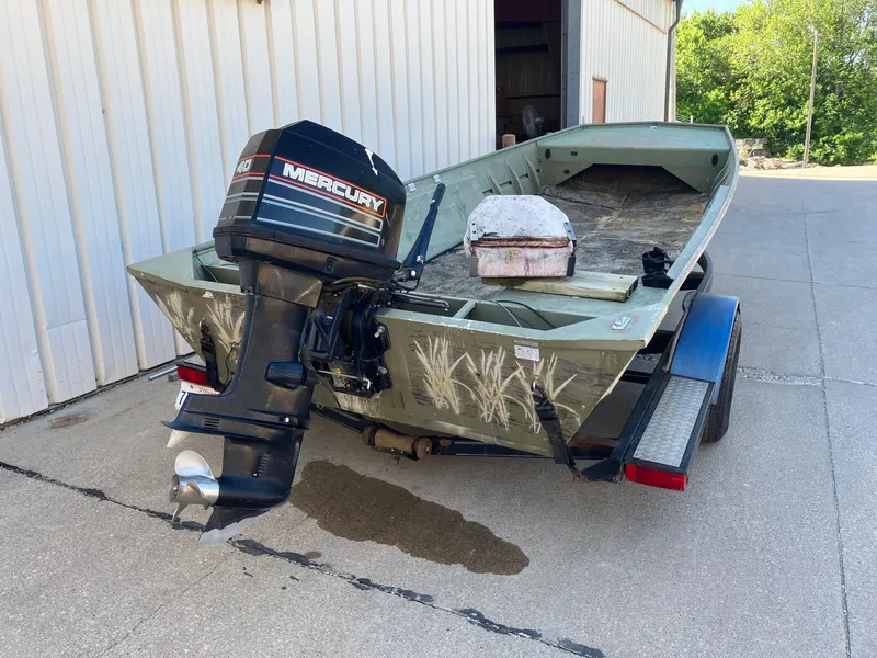 Slide: The Image of 1994 Lowe 1960 HUSKY boat with Mercury outboard motor on trailer. - 7