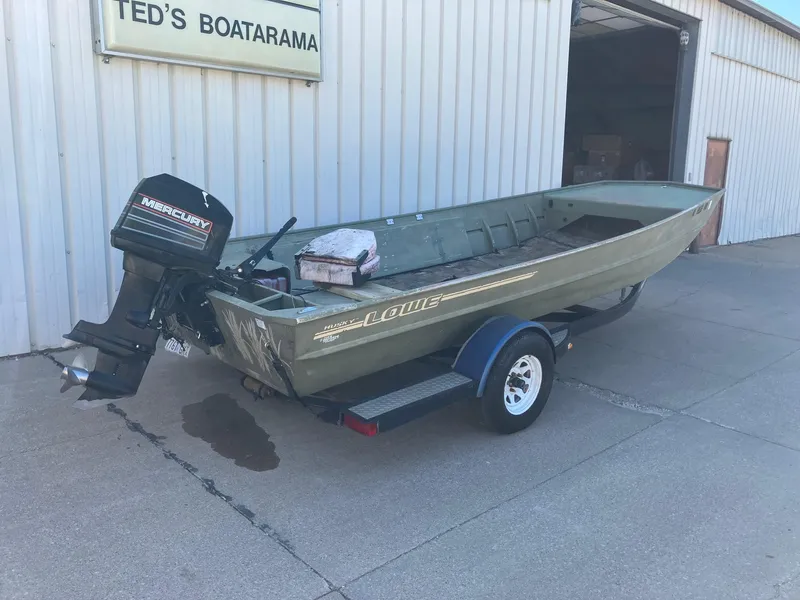 Slide: The Image of 1994 Lowe 1960 HUSKY boat on trailer outside Ted's Boatarama. - 8