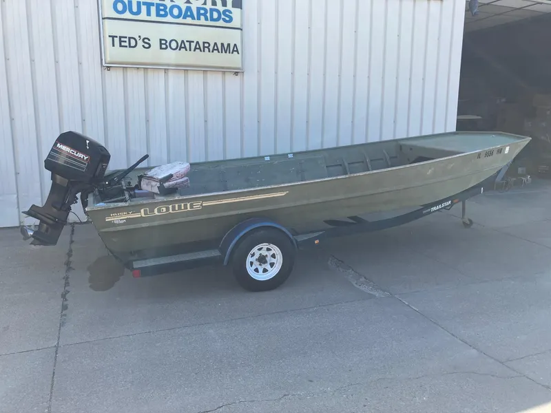 Slide: The Image of 1994 Lowe 1960 HUSKY boat on trailer outside Ted's Boatarama. - 9