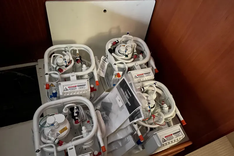 Slide: The Image of Four marine air conditioning units inside a 1981 Hatteras 48 Motor Yacht. - 16