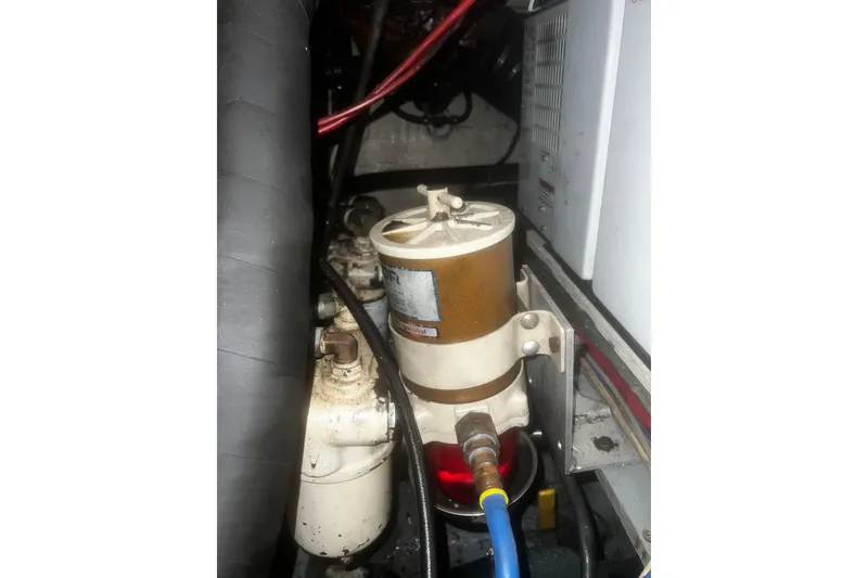 Slide: The Image of Engine compartment of 1981 Hatteras 48 Motor Yacht showing fuel filter system. - 18