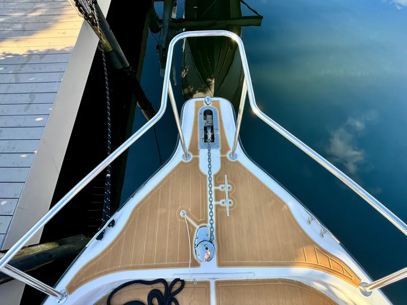 Slide: The Image of Bow of a 2006 Century 3200 Walk-Around boat docked by the pier. - 15