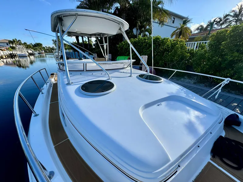 Slide: The Image of 2006 Century 3200 Walk-Around boat docked in a scenic canal. - 17