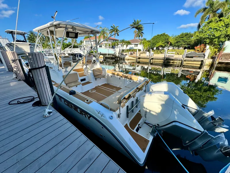 Slide: The Image of 2006 Century 3200 Walk-Around boat docked at a marina. - 2
