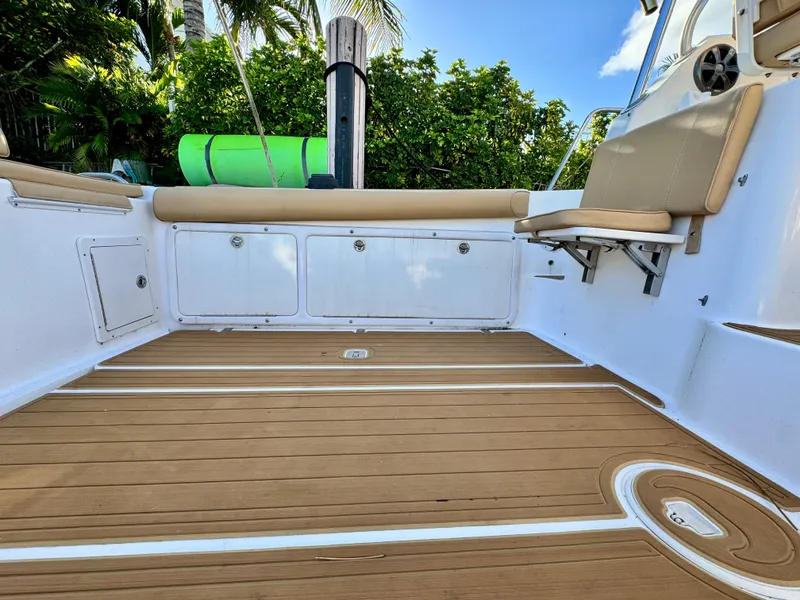 Slide: The Image of 2006 Century 3200 Walk-Around boat deck with seating and storage compartments. - 20