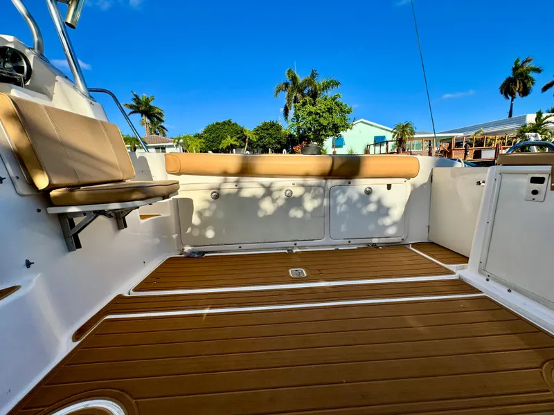 Slide: The Image of 2006 Century 3200 Walk-Around boat deck with seating and teak flooring. - 22