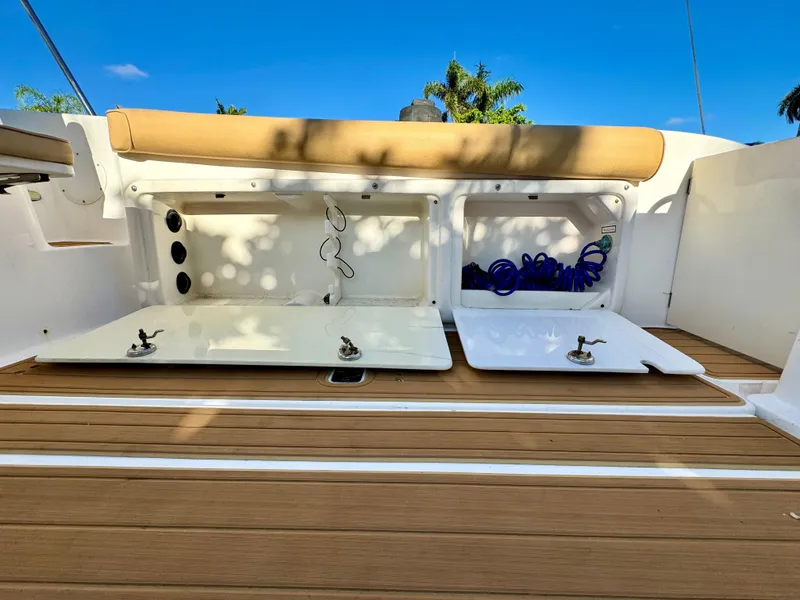 Slide: The Image of 2006 Century 3200 Walk-Around boat deck with storage compartments open. - 23