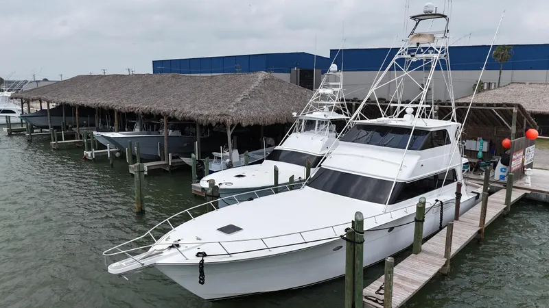 Slide: The Image of 1996 Donzi Custom Enclosed Flybridge yacht docked at marina. - 12