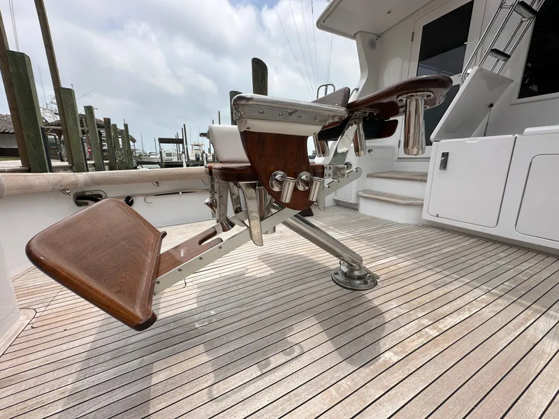 Slide: The Image of 1996 Donzi Custom Enclosed Flybridge fishing chair on teak deck. - 26