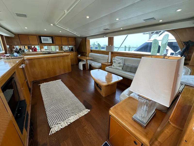 Slide: The Image of Interior of a 1996 Donzi Custom Enclosed Flybridge yacht with wooden furnishings. - 34