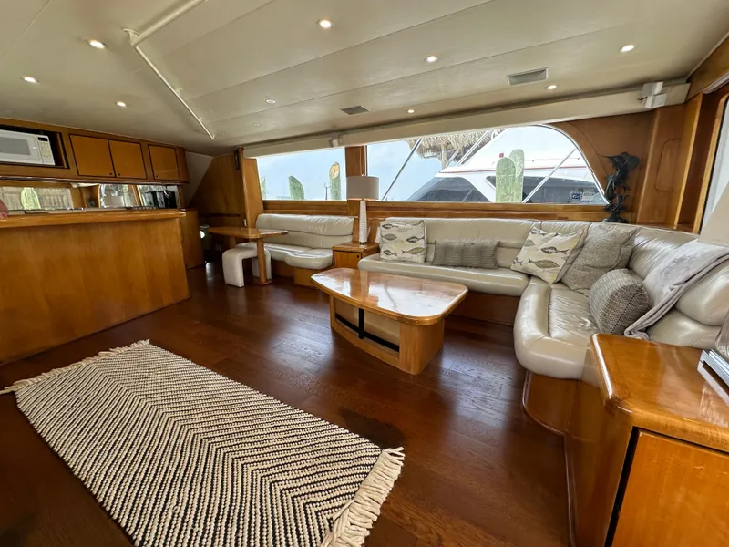 Slide: The Image of Luxurious interior of a 1996 Donzi Custom Enclosed Flybridge yacht with wooden finishes. - 38