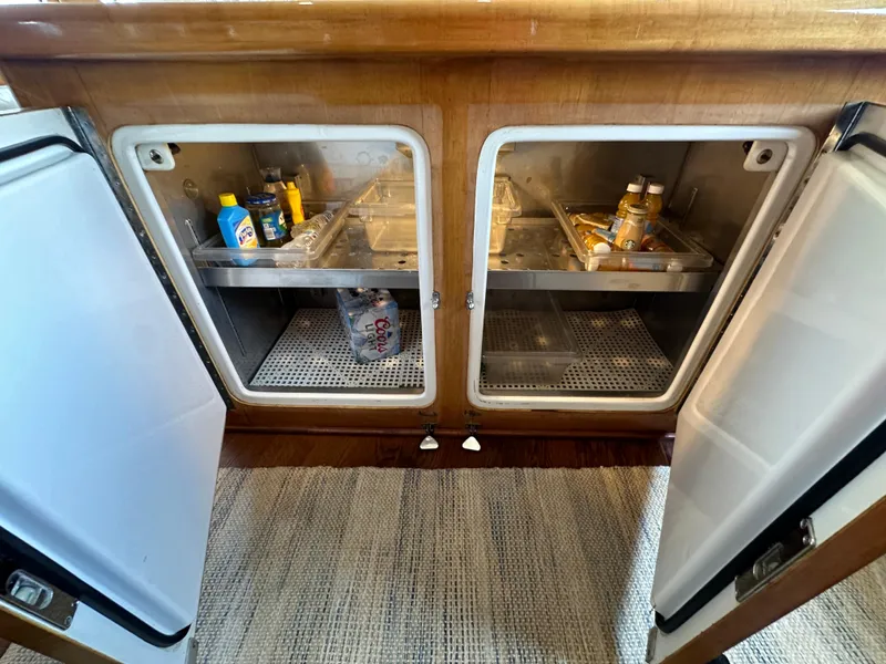 Slide: The Image of Open refrigerator on a 1996 Donzi Custom Enclosed Flybridge yacht. - 46