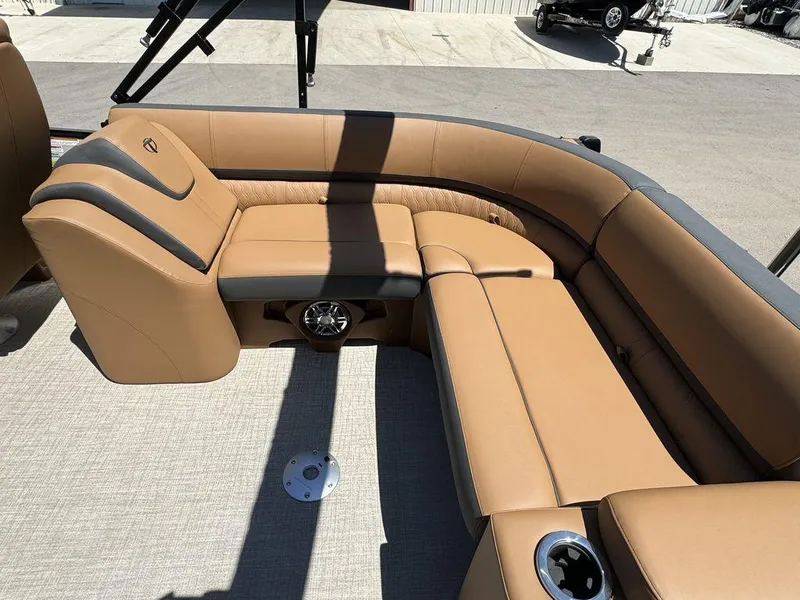 Slide: The Image of Luxurious seating area on the 2024 Tahoe Cascade 2385 EL pontoon boat. - 10