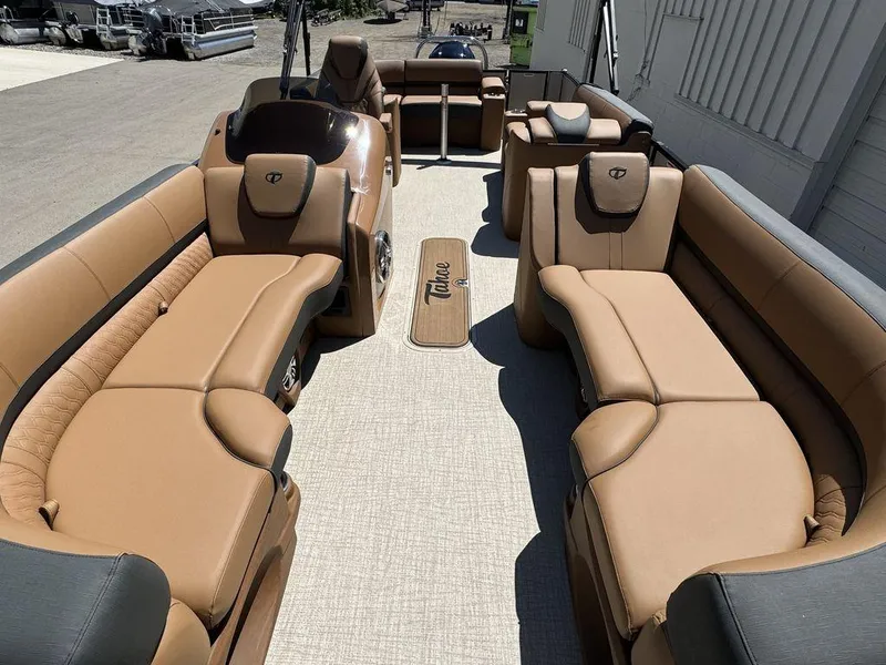 Slide: The Image of 2024 Tahoe Cascade 2385 EL pontoon boat with luxurious tan seating and spacious layout. - 3