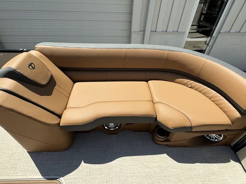 Slide: The Image of 2024 Tahoe Cascade 2385 EL boat with luxurious tan leather seating. - 6