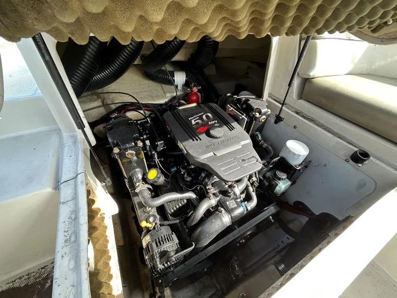Slide: The Image of 2007 Sea Ray 220 Sundeck engine compartment with 5.0L MerCruiser engine. - 10