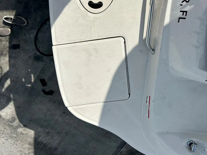 Slide: The Image of 2007 Sea Ray 220 Sundeck boat deck with storage compartment. - 21