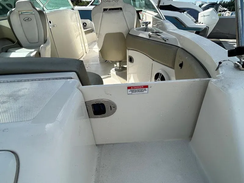 Slide: The Image of 2007 Sea Ray 220 Sundeck interior view with seating and dashboard. - 22