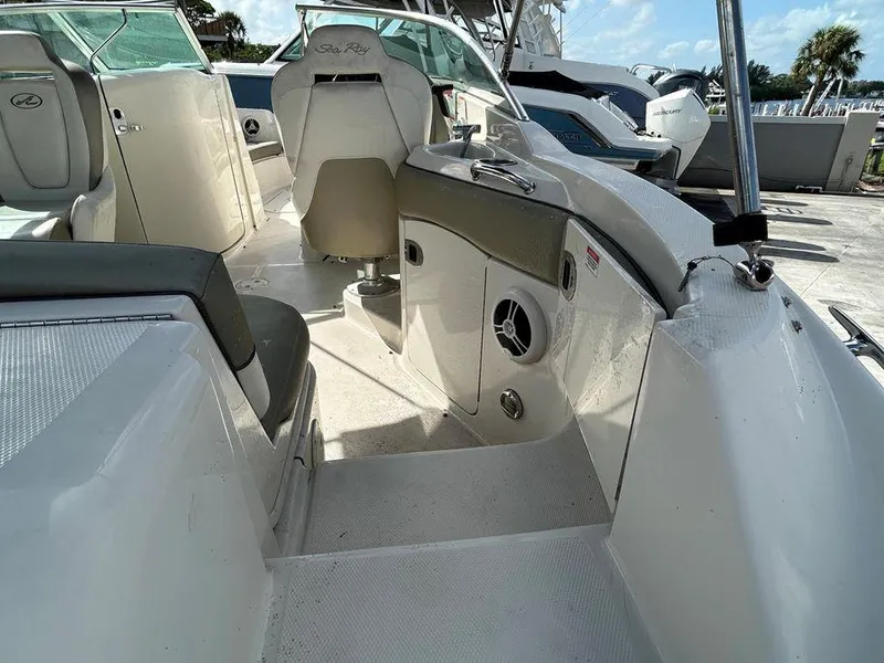 Slide: The Image of 2007 Sea Ray 220 Sundeck interior view with seating and helm. - 23