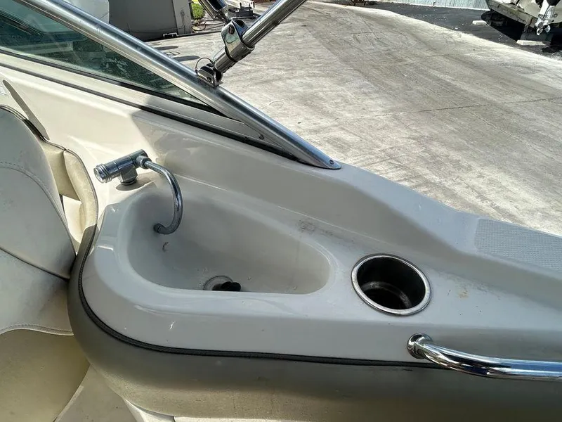 Slide: The Image of 2007 Sea Ray 220 Sundeck boat interior with sink and cup holder. - 25