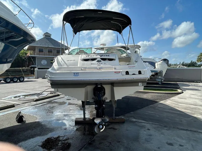 Slide: The Image of 2007 Sea Ray 220 Sundeck boat on a trailer in a marina. - 3