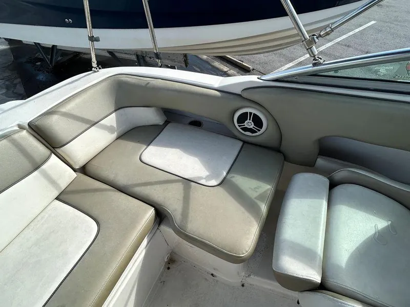 Slide: The Image of 2007 Sea Ray 220 Sundeck interior seating area with speaker. - 32
