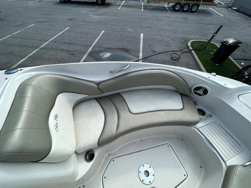 Slide: The Image of 2007 Sea Ray 220 Sundeck boat interior with cushioned seating. - 33