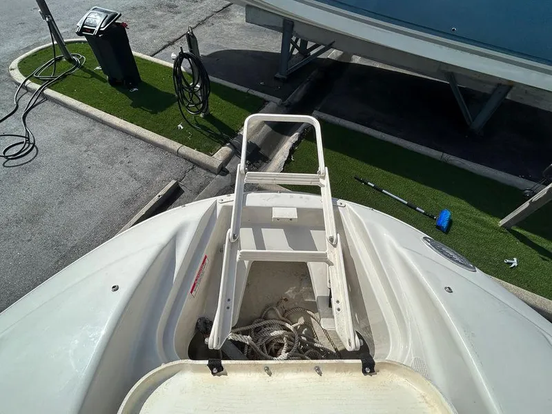 Slide: The Image of 2007 Sea Ray 220 Sundeck boat bow with ladder and storage compartment. - 36