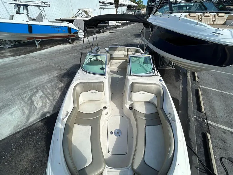 Slide: The Image of 2007 Sea Ray 220 Sundeck boat with spacious seating and sleek design. - 8
