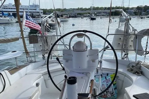 Slide: The Image of Cockpit view of a 2005 Beneteau 423 sailboat docked in a marina. - 11