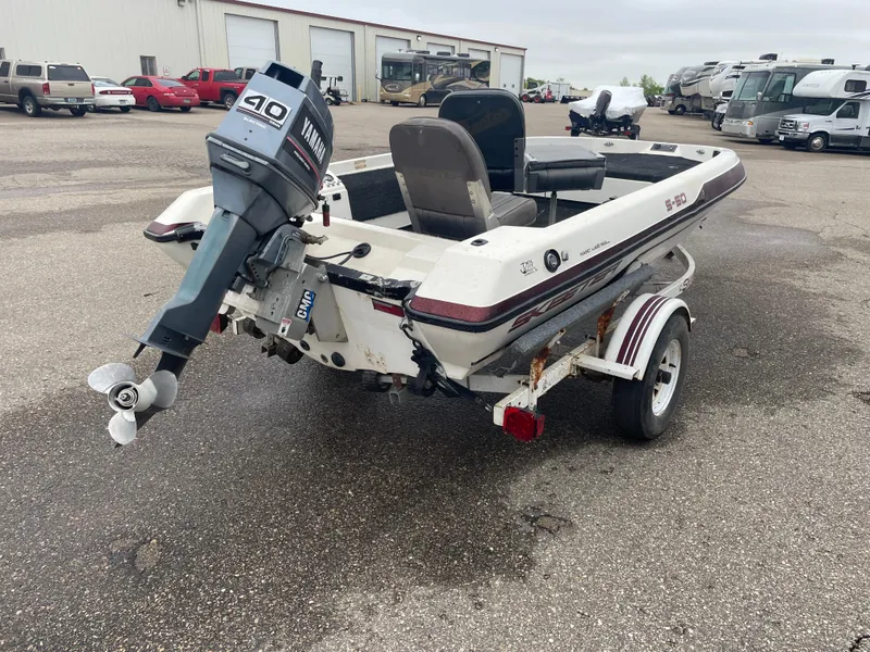 Slide: The Image of 1990 Skeeter S-50 boat with Yamaha 40 HP outboard motor on a trailer. - 3
