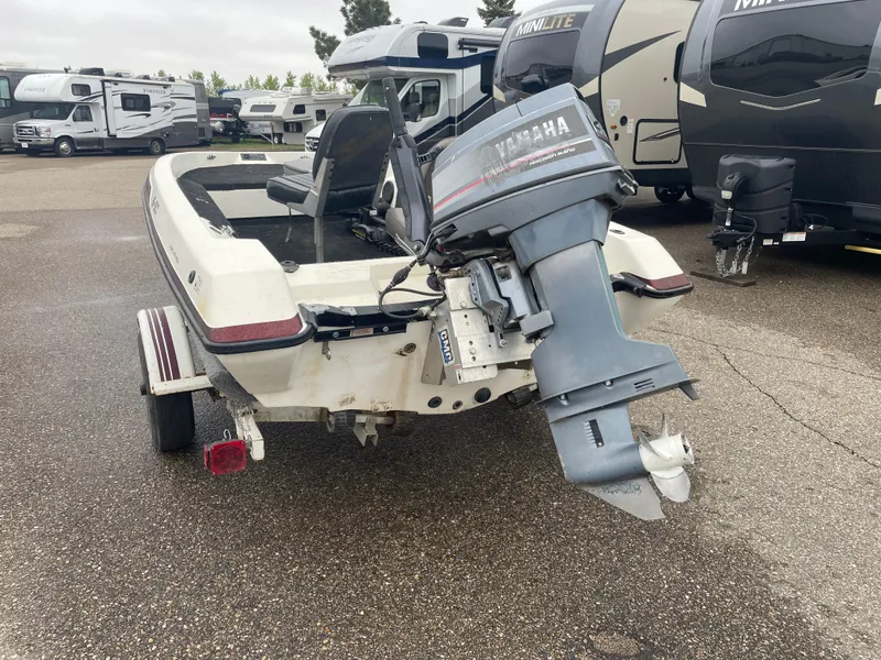 Slide: The Image of 1990 Skeeter S-50 boat with Yamaha outboard motor in RV parking lot. - 4