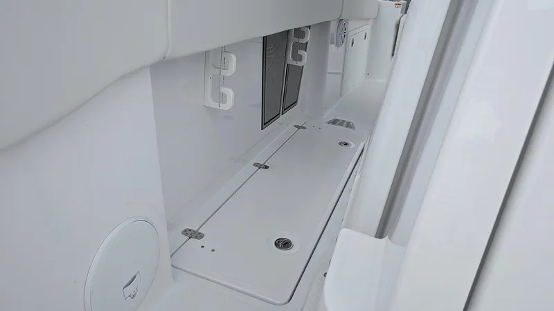Slide: The Image of 2024 Wellcraft 263 Fisherman boat interior storage compartments. - 12