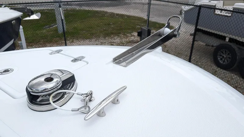 Slide: The Image of 2024 Wellcraft 263 Fisherman boat deck with anchor holder and cleat. - 19