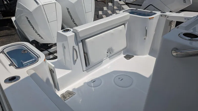 Slide: The Image of 2024 Wellcraft 263 Fisherman boat deck with Mercury outboard engines. - 4