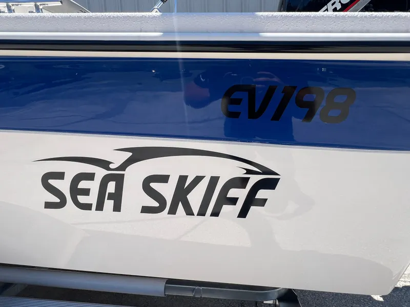 Slide: The Image of 2024 Carolina Skiff EV198 Sea Skiff boat side view with logo. - 20