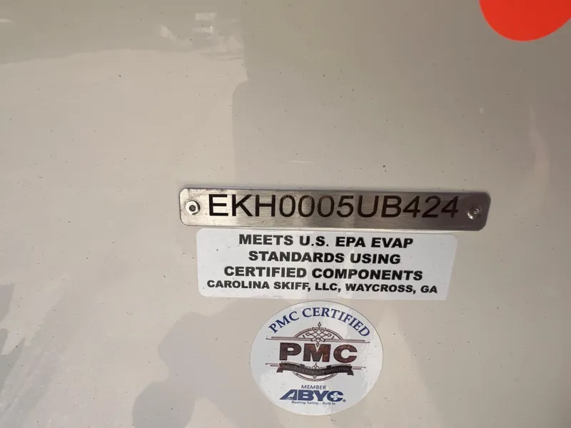 Slide: The Image of 2024 Carolina Skiff EV198 certification labels and serial number. - 21