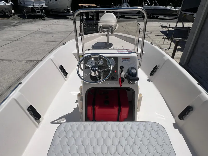 Slide: The Image of 2024 Carolina Skiff EV198 boat interior with steering console and seating. - 4